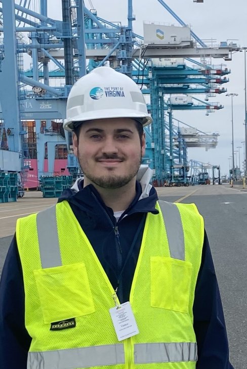 David Costello wearing a hard hat and safety vest at the Port of Virginia.