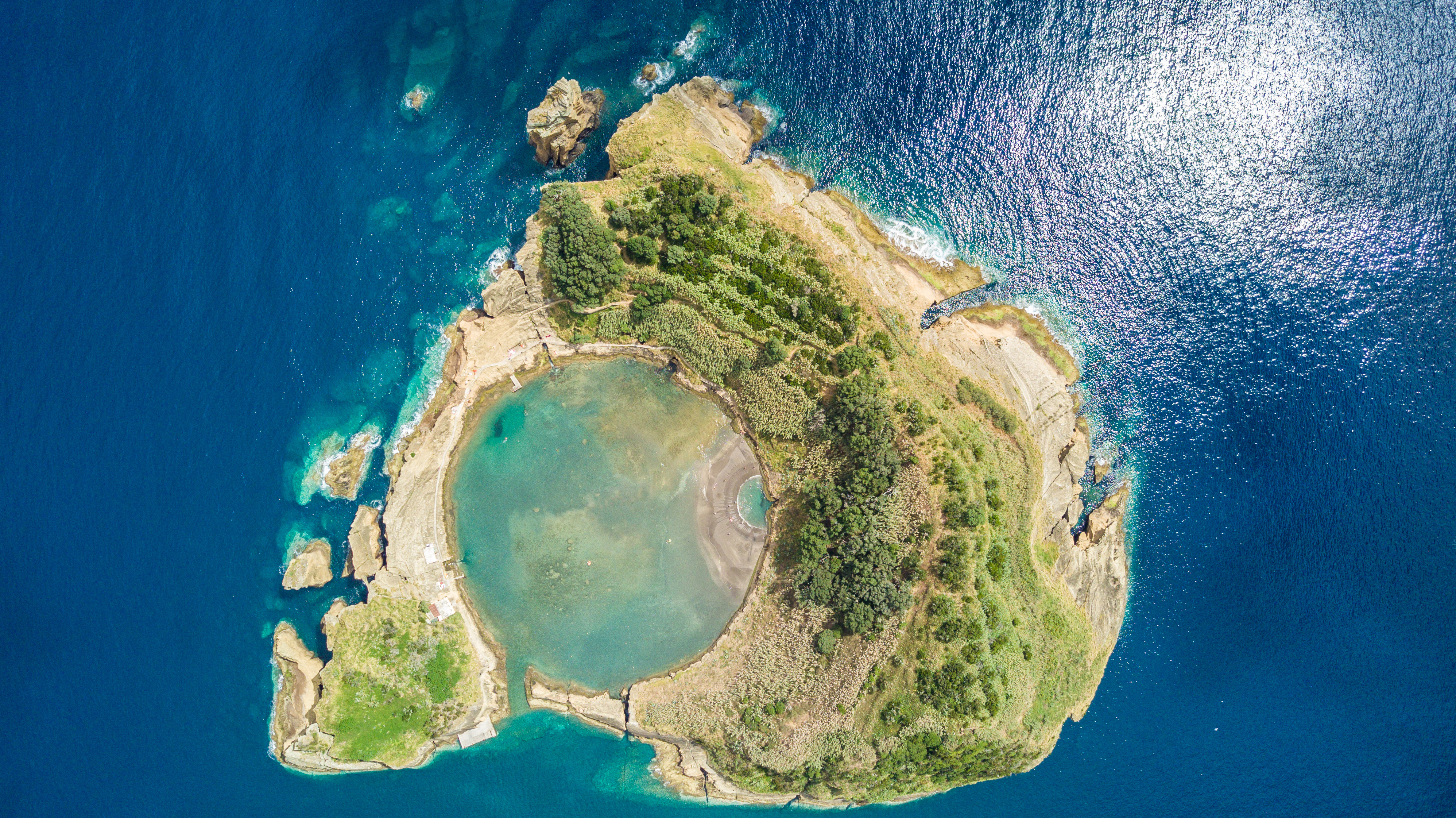 Top view of Islet of Vila Franca do Campo is formed by the crater of an old underwater volcano near San Miguel island, Azores, Portugal. Bird eye view, aerial panoramic view.