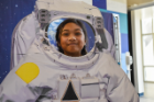 Savannah Viar enjoys the astronaut selfie station. Photo Chuck Thomas/ODU