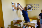 Shelby Alphin does not waste any time making her room feel like home. Photo Chuck Thomas/ODU