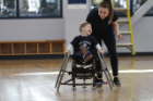 Old Dominion University's Mighty Monarchs Adapted Sports Program allows children with special needs to participate in athletics - for free. Here Daniel "Bubba" James, 3 years old, gets encouragement from Summer Trzcinski, therapeutic recreation major. Photo David B. Hollingsworth/ODU