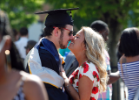 This graduate receives a congratulatory kiss after the Saturday afternoon commencement ceremony. Photo David B. Hollingsworth/ODU