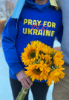 An attendee at the Solidarity for Ukraine vigil on Kaufman Mall shows her support. Photo Amber Kennedy/ODU