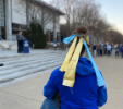 A spectator wears the Ukrainian colors. Photo Amber Kennedy/ODU
