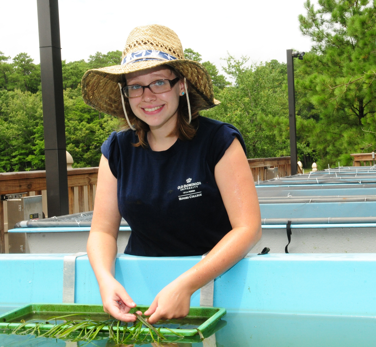 photo of intern researcher Miranda Smith at ODU aqua-farm 