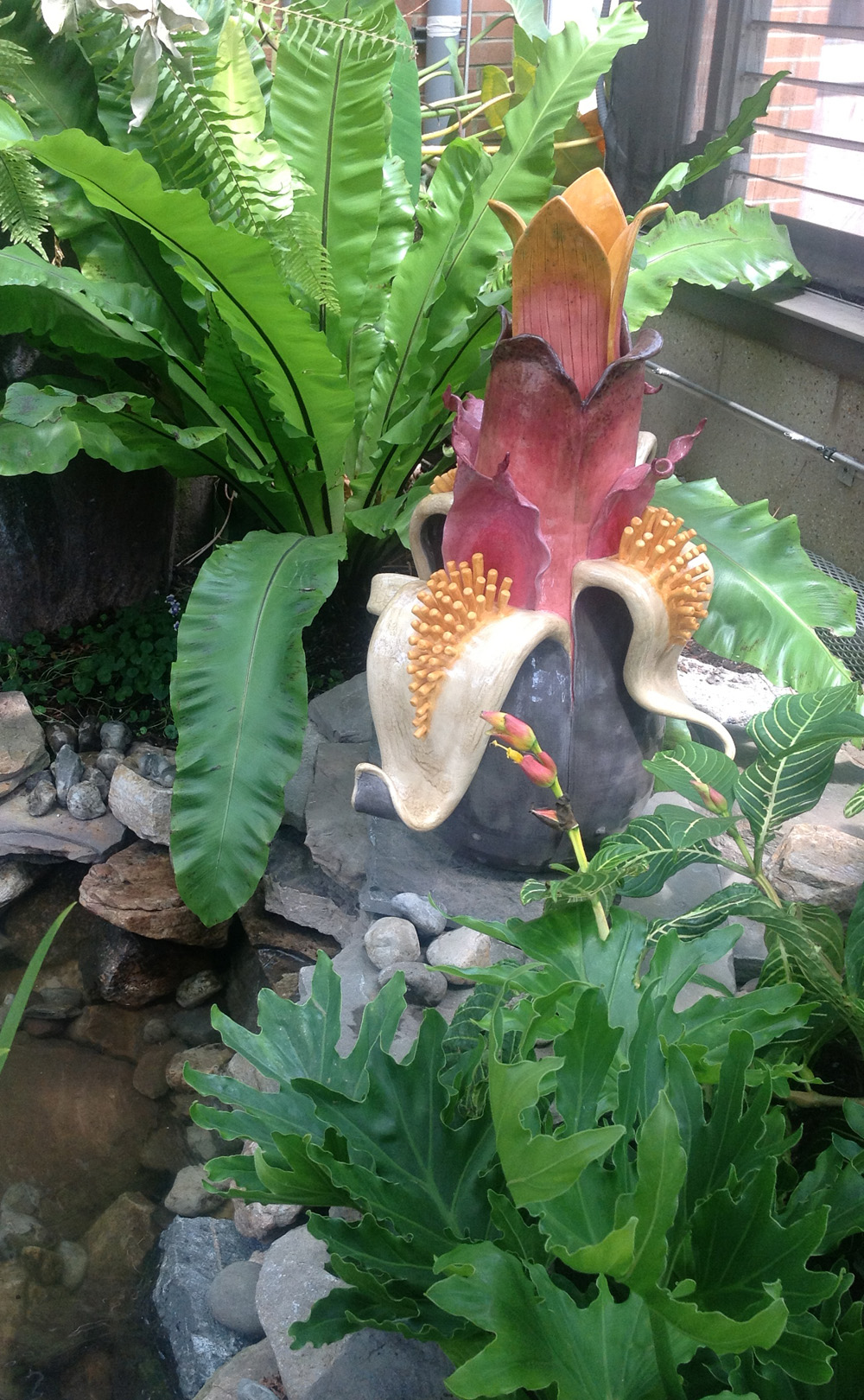 Picture of one of the sculptures on display at Orchid Conservatory "Fruitoids Invade" show