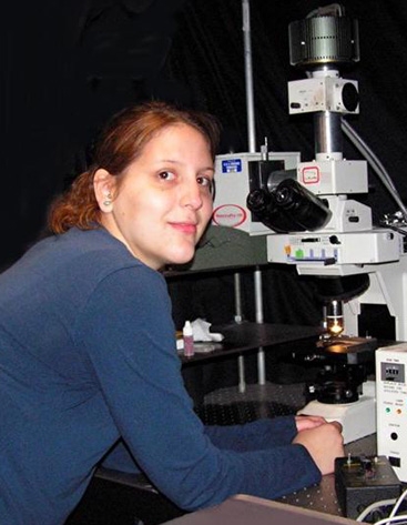 Photoof Lauren Browning, Xu Group researcher, at microscope