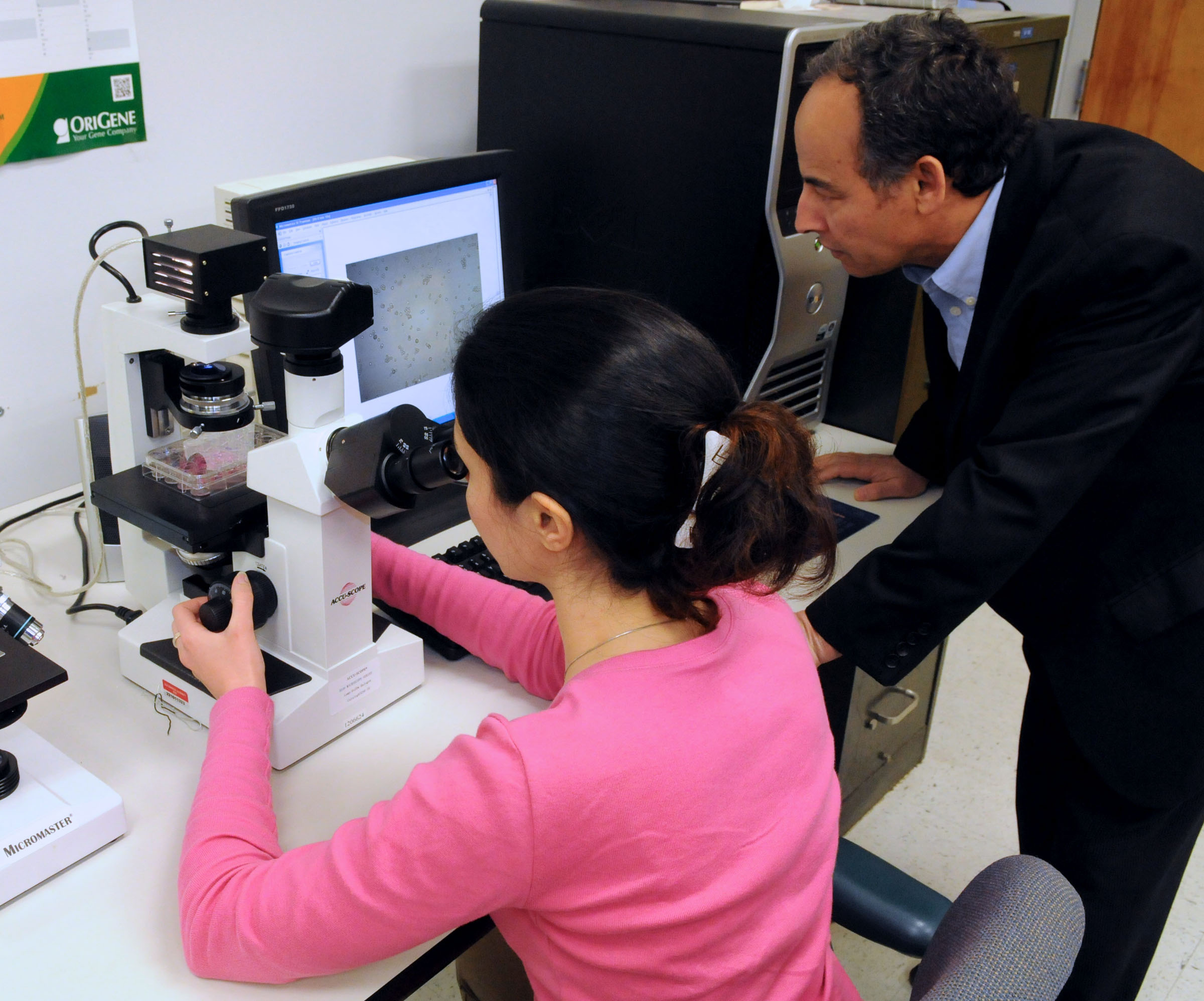 photo of ODU's Mounir Laroussi in lab with a Ph.D. student
