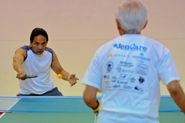 Photo of Ricardo Macarans playing Lalami Iqbal in Table Tennis at the Senior Olympics