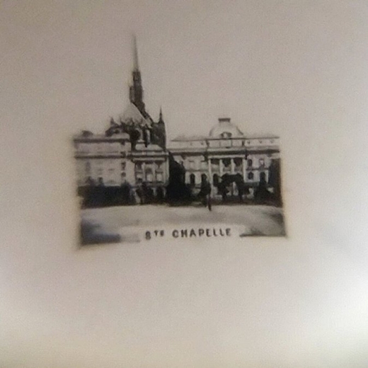 A photo of a micro-photographic image of Ste. Chappelle that is included in the doll's Stanhope necklace.