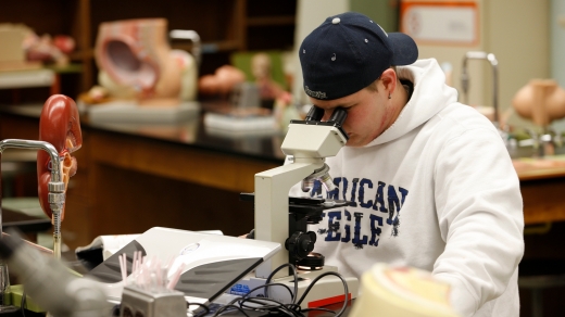 Student Using Microscope