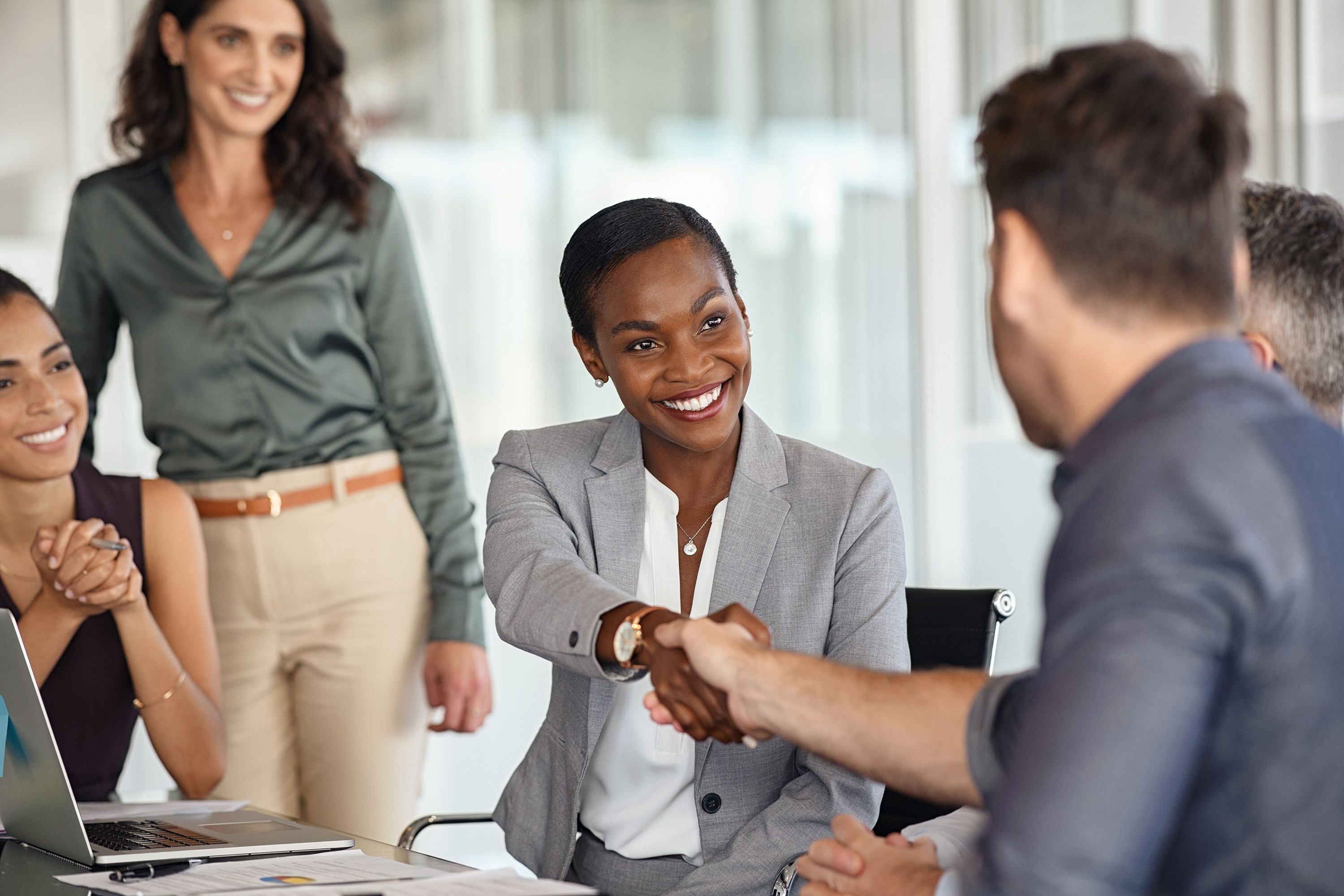 Business woman shaking hands