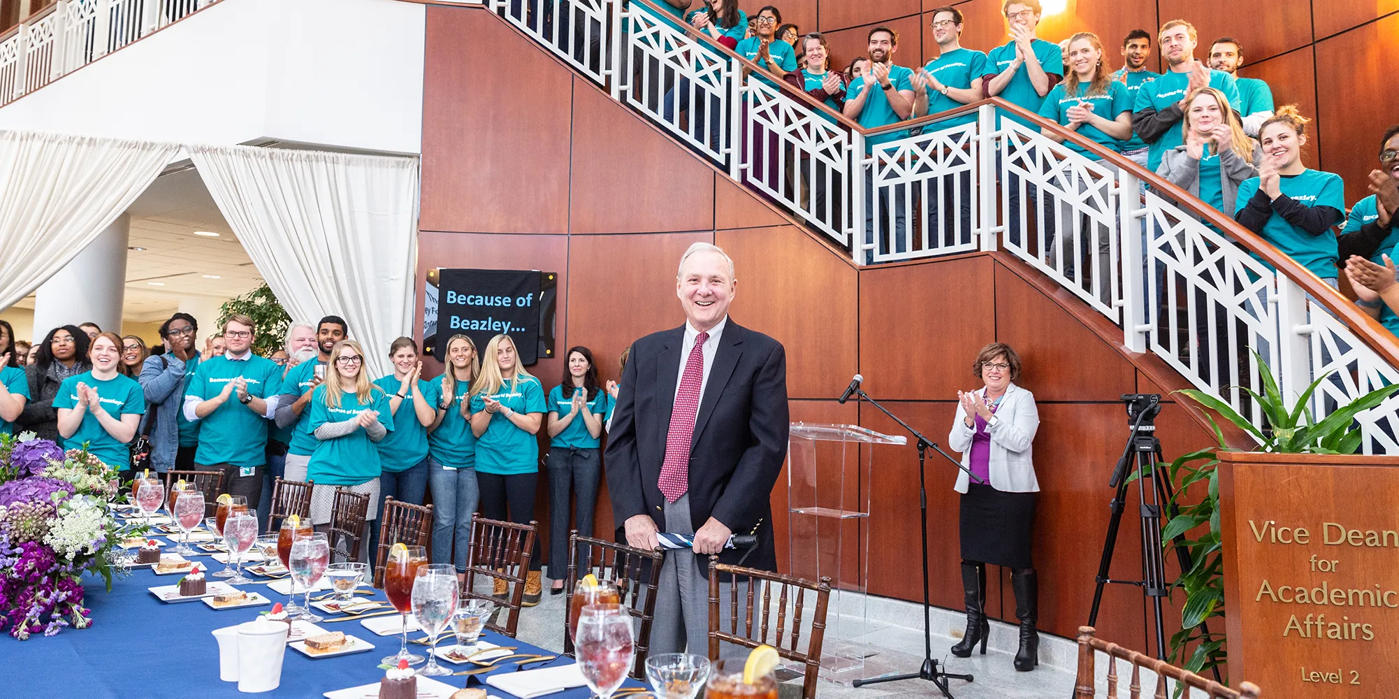 Judge Richard Bray stands in the center while dozens of stud
