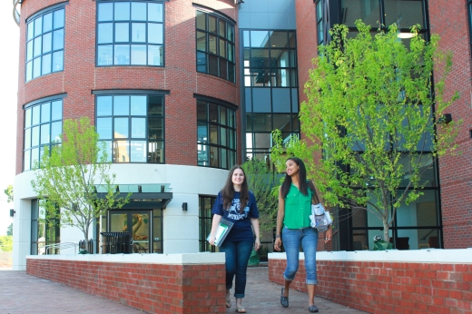 Students walking in front of the Barry Arts Building.