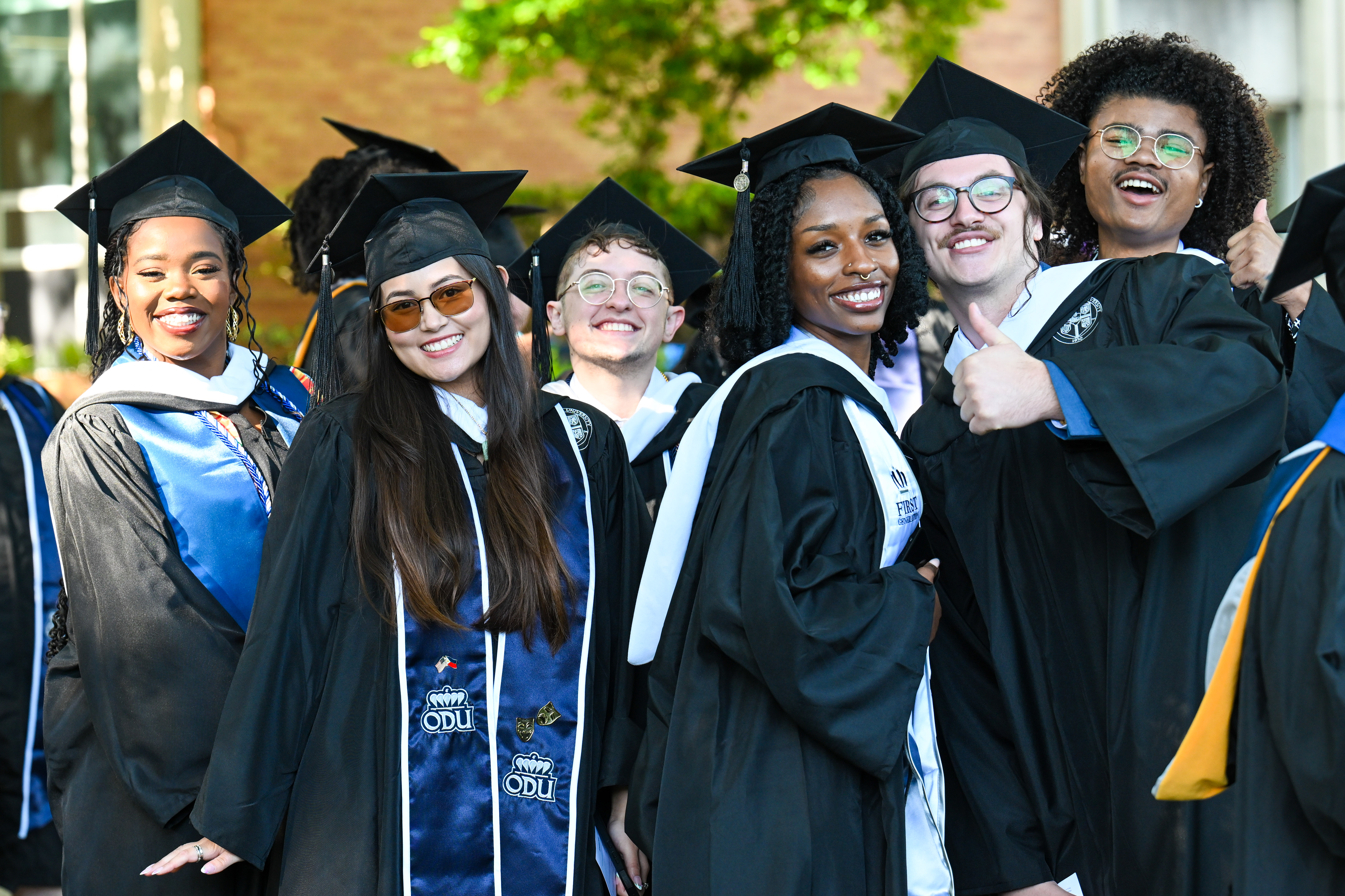 A group of students in their graduation caps and gowns.