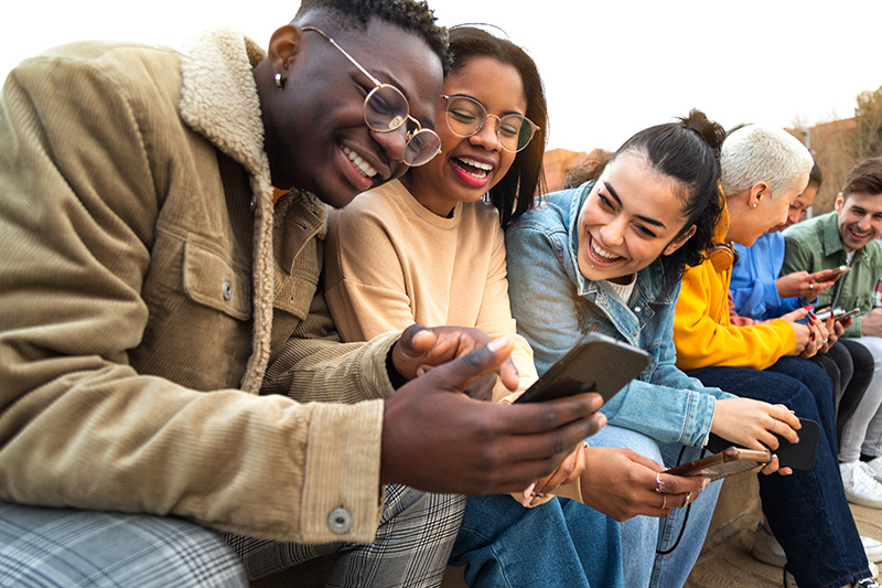 Civility students look at phone