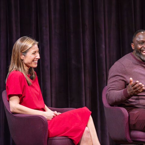 Two people sitting and talking