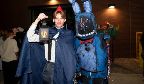 Two people in halloween costumes.