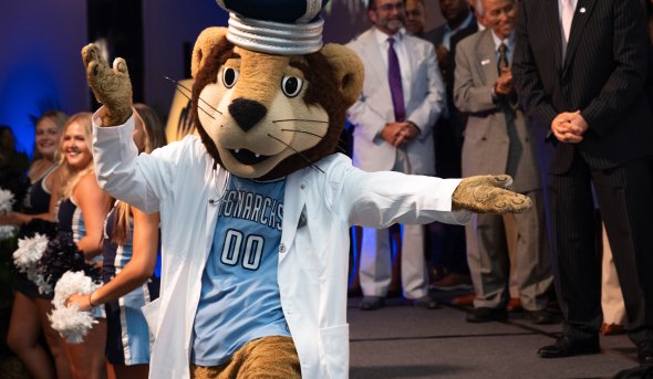 odu mascot in white lab coat