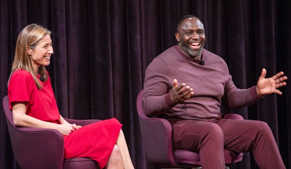 Two people sitting and talking