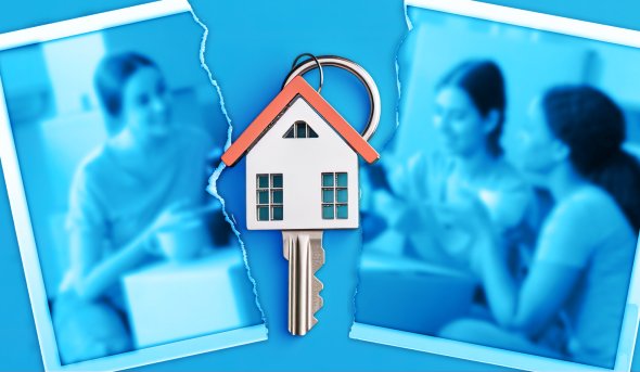An image of a photo torn in half with a house key in the middle.