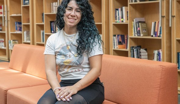 a woman sits on a couch