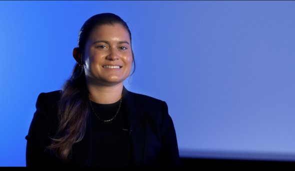 Portrait of young woman on blue background