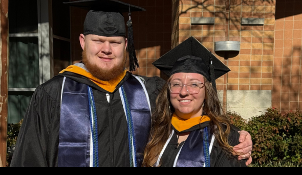 Two students standing next to each other.