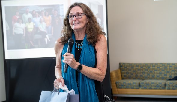 A woman holding a microphone.