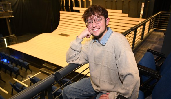 A photo of Taylor Tousignant in a theater.