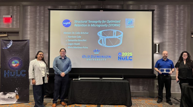 Students in front of a presentation at a conference