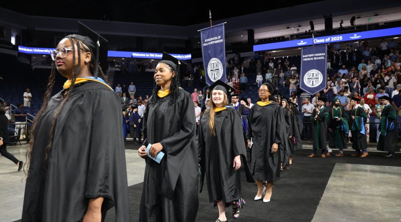 Students lining up to receive their diplomas