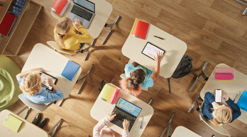 Students using mobile devices in a classroom