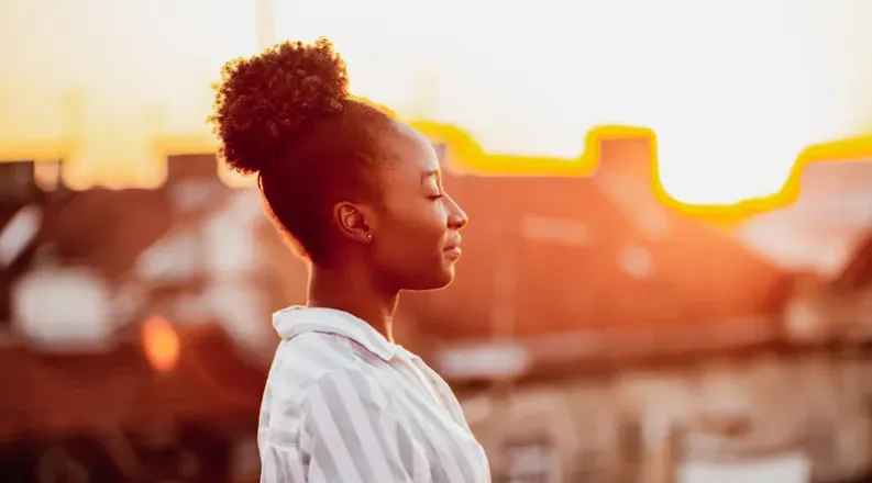 Woman meditating outside