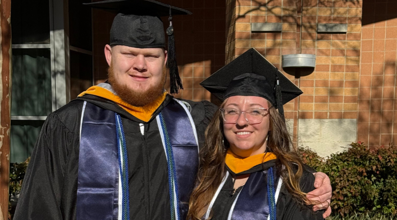 Two students standing next to each other.