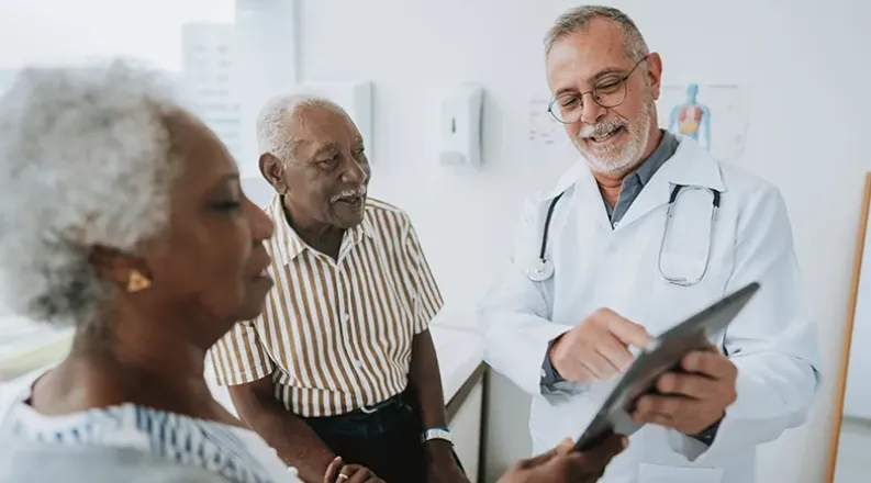 patient looking at a chart with a doctor.