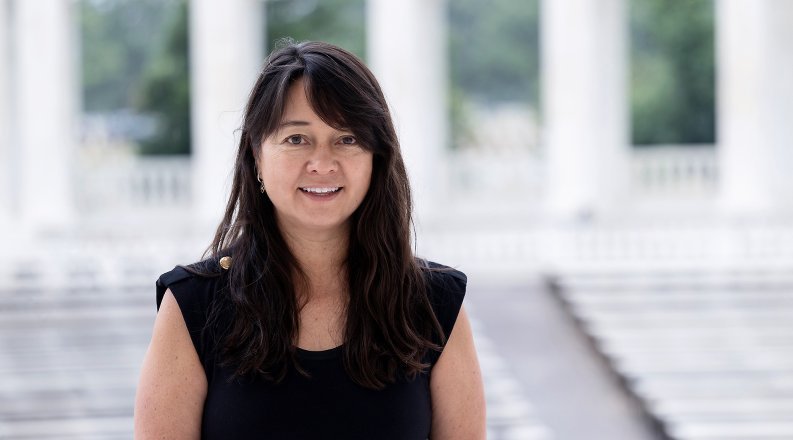 A woman in front of a set of steps.