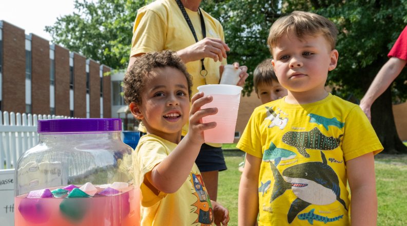 Children serving lemonade