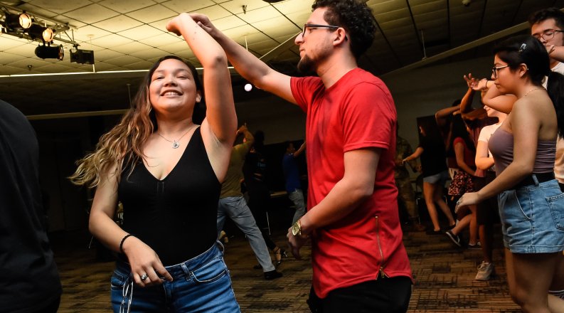 Two students dancing.