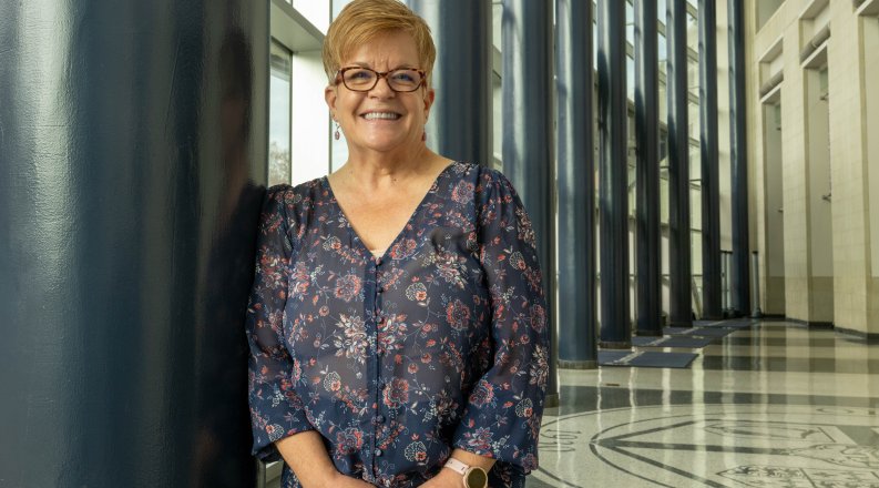 ODU alumna Michele Mulich inside the large lobby at Chartway. 