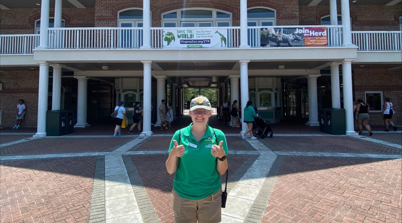 Courtni, a MonarchTeach student at ODU stands in front of the Virginia Zoological Park.