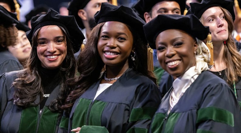 Three students in graduation caps