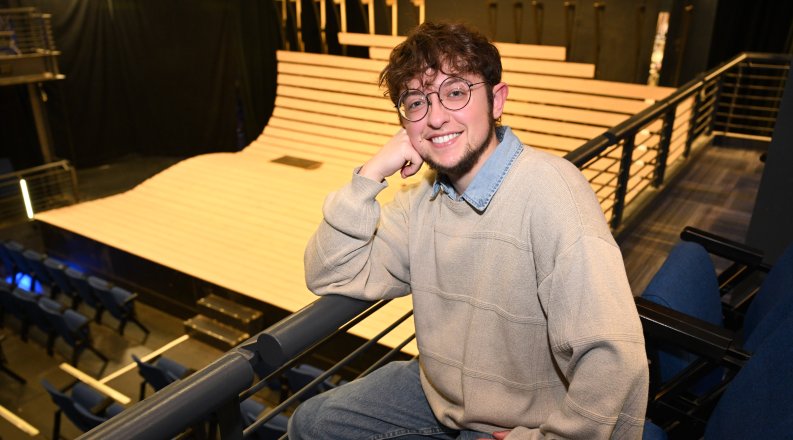 A photo of Taylor Tousignant in a theater.