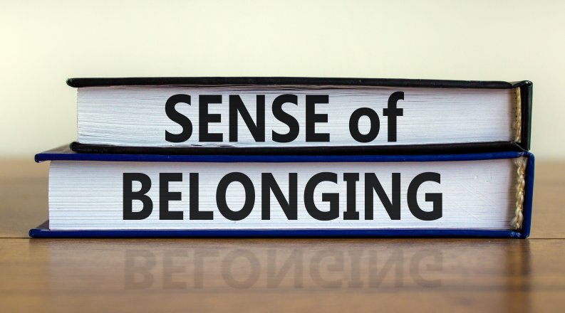 Sense of belonging symbol. Books with words 'sense of belong