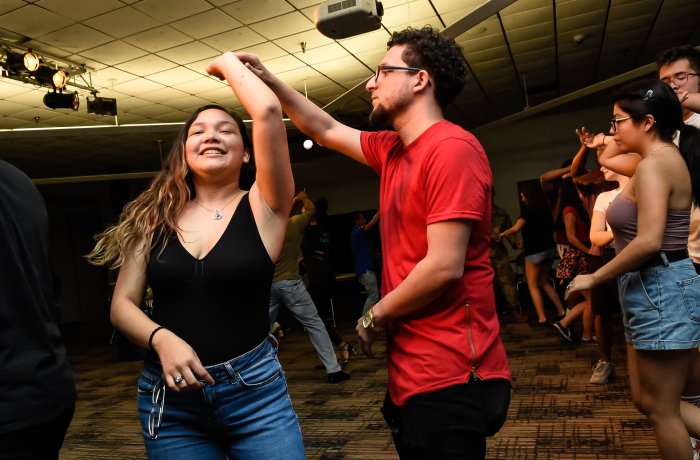 Two students dancing.