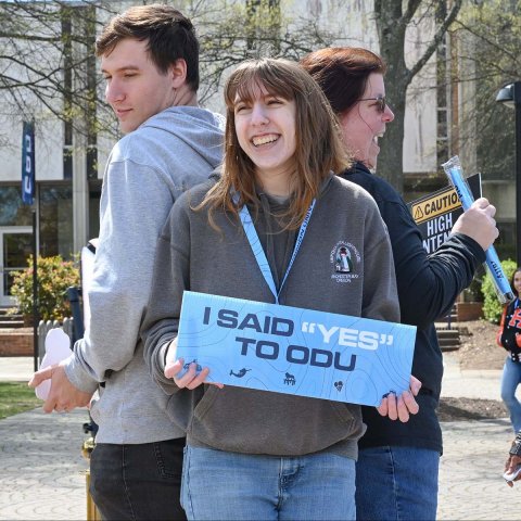 student holding I said Yes to ODU sign