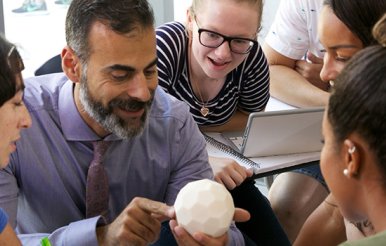 Professor Katsioloudis & ODU students work together in a classroom inside the new education building.