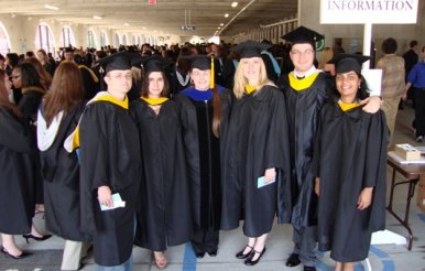 Physics masters students getting ready for commencement