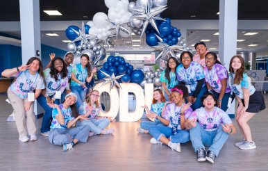 group of odu students under a balloon arch
