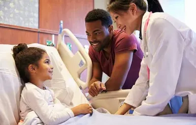 A doctor consults with a pediatric patient.